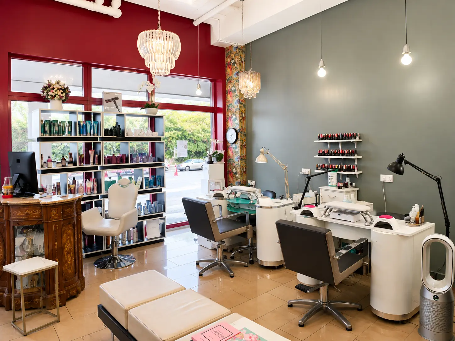 Nail bar and retail wall inside the salon, lit by the front window