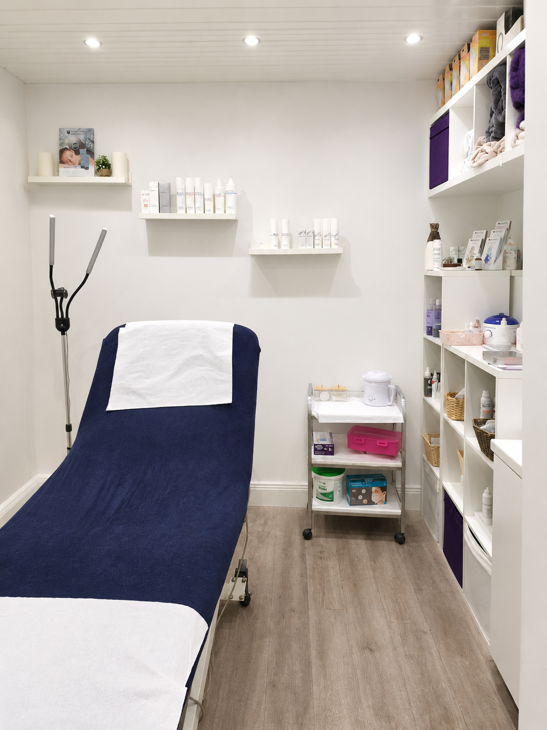 Treatment room set up with a massage table